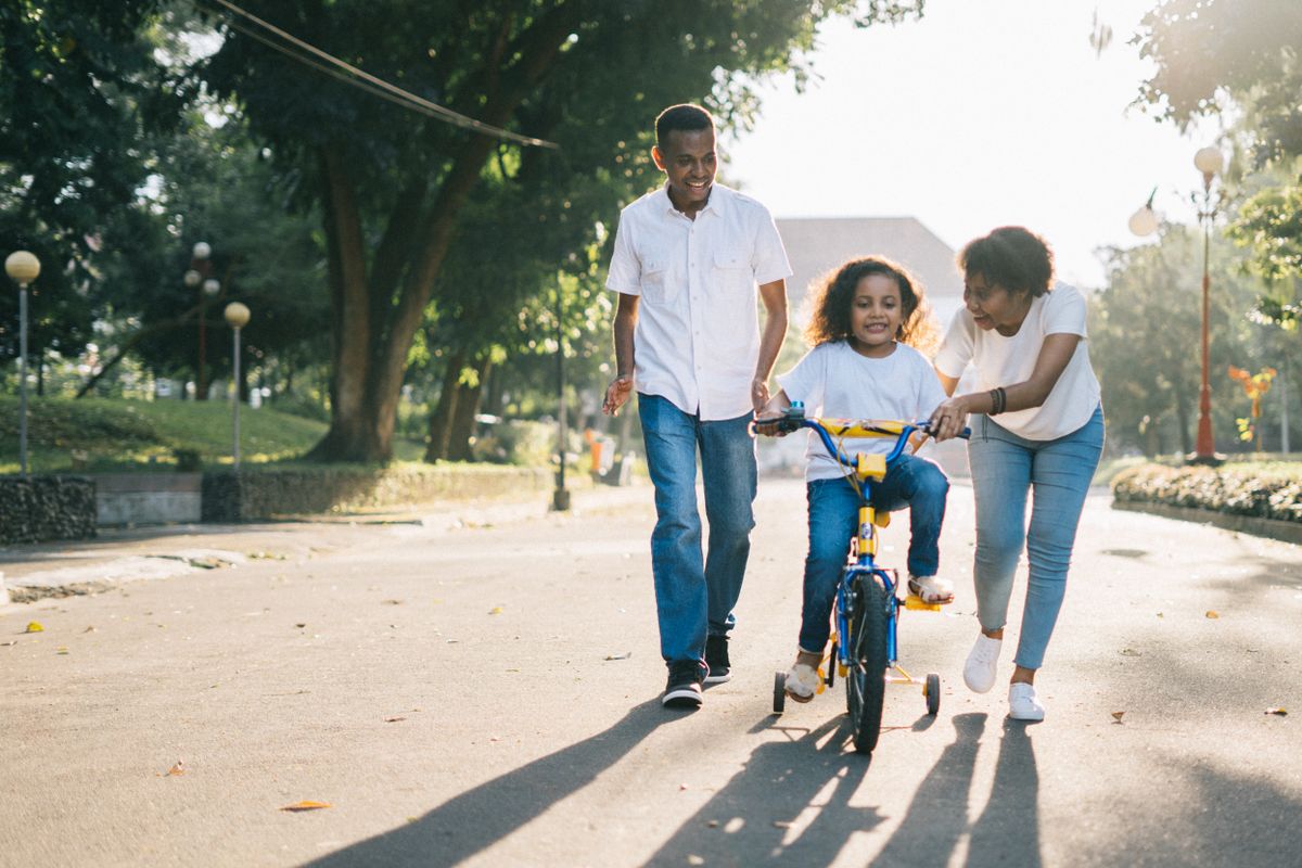 A happy, active family enjoying time outdoors together